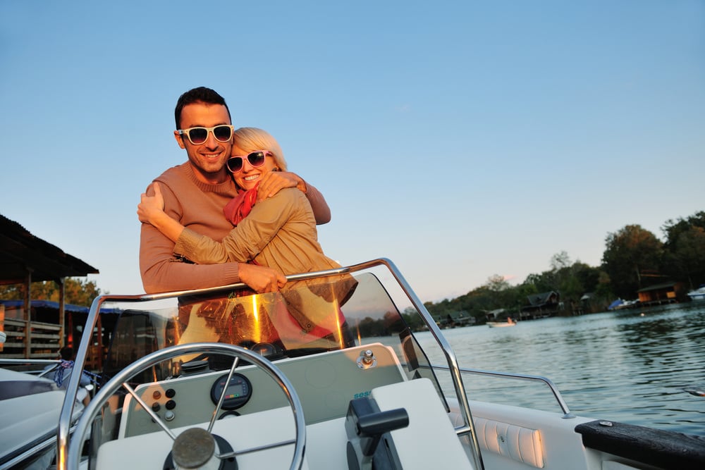 happy young couple in love have romantic time at summer sunset at ship boat while representing urban and countryside fashin lifestyle happy young couple in love have romantic time at summer sunset at ship boat while representing urban and countryside fashin lifestyle