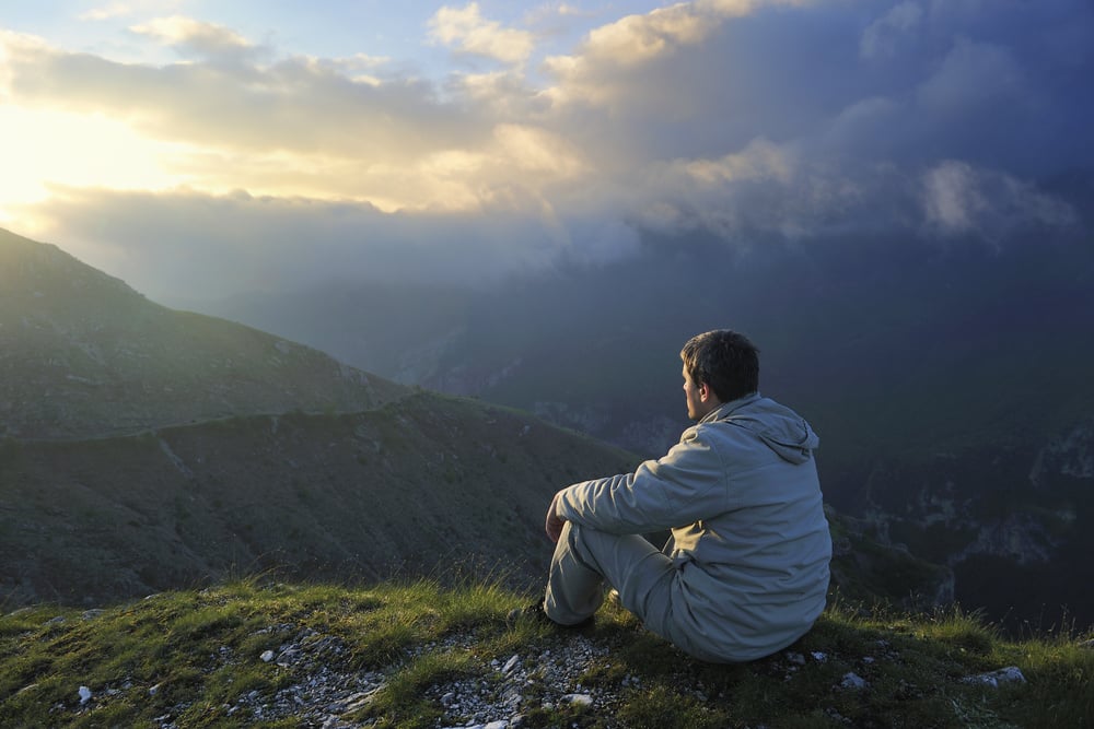 healthy young man practice yoga in height mountain at early morning and sunrise